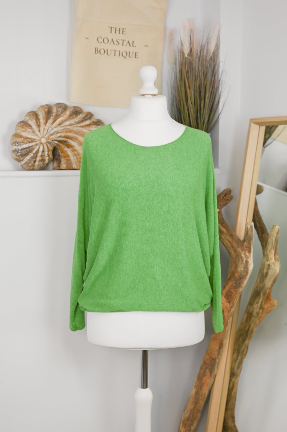 Women's long-sleeved round neck knitted jumper on a mannequin