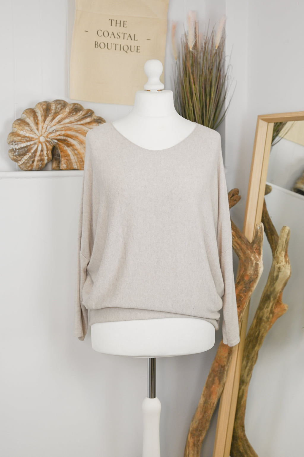 Women's long-sleeved round neck knitted jumper on a mannequin