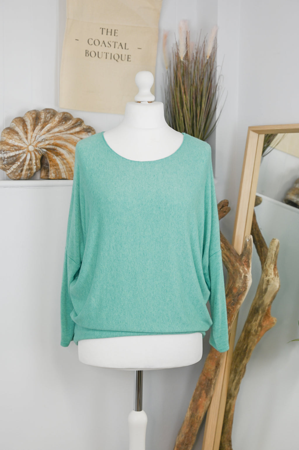 Women's long-sleeved round neck knitted jumper on a mannequin