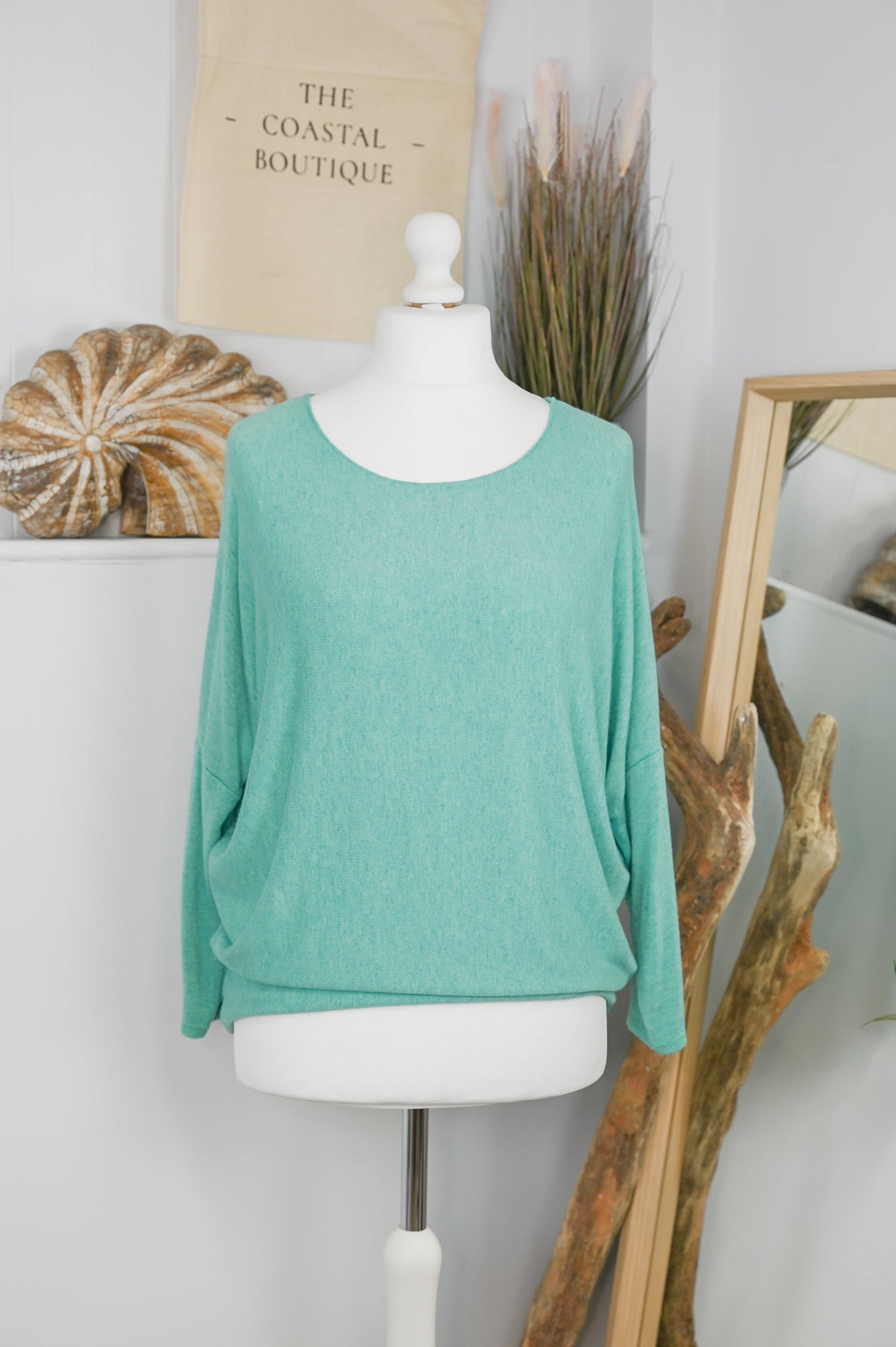 Women's long-sleeved round neck knitted jumper on a mannequin