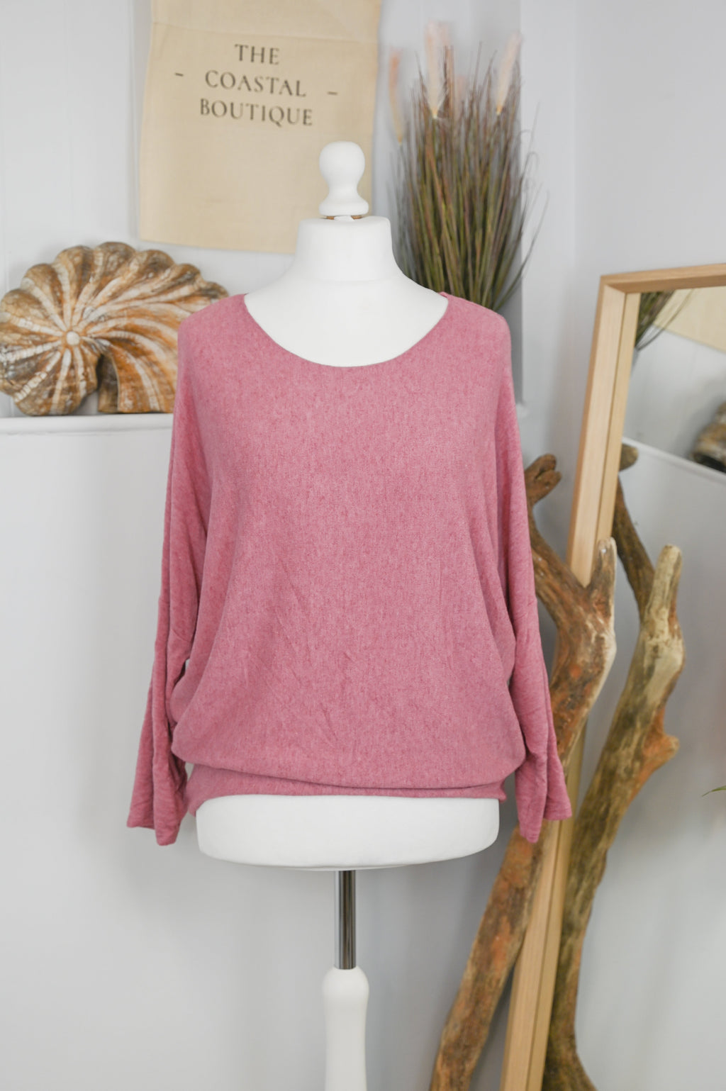Women's long-sleeved round neck knitted jumper on a mannequin