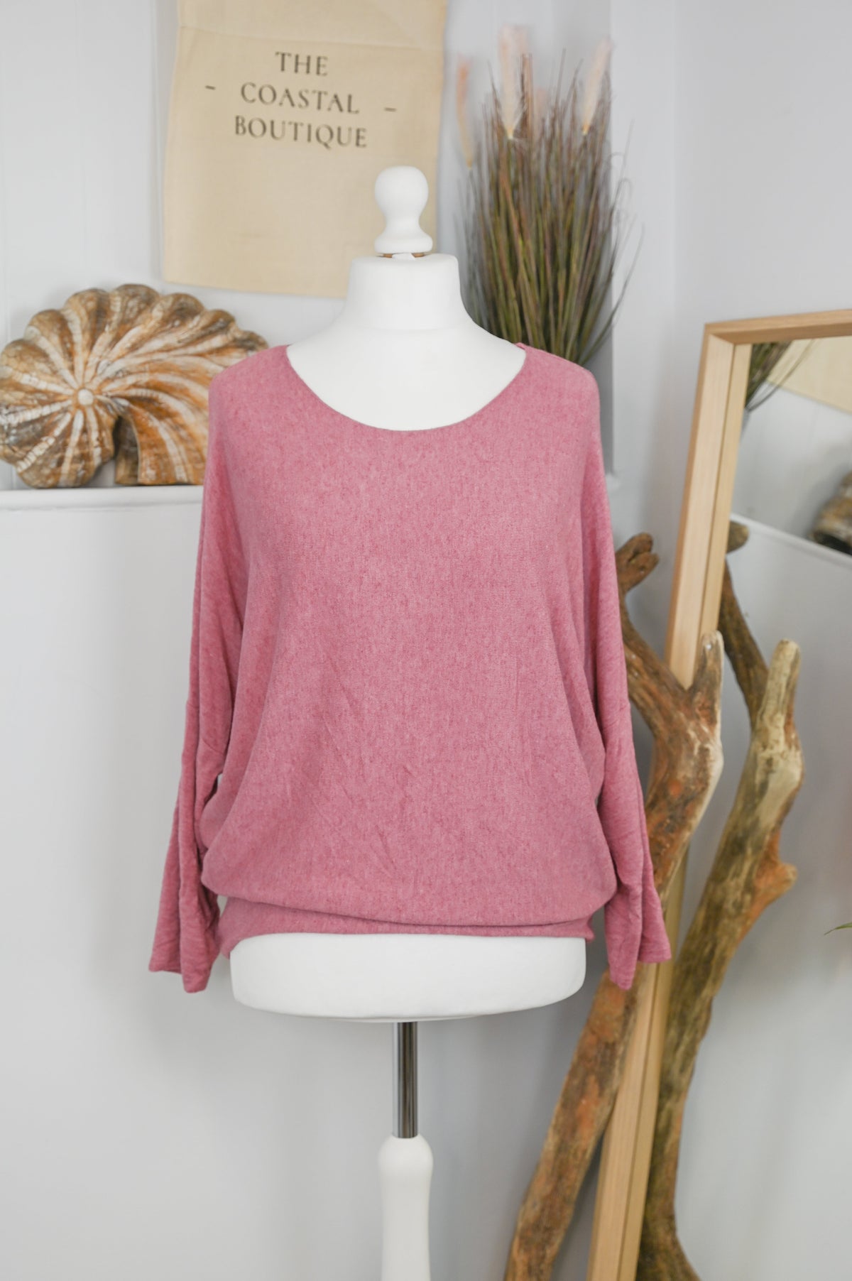 Women's long-sleeved round neck knitted jumper on a mannequin