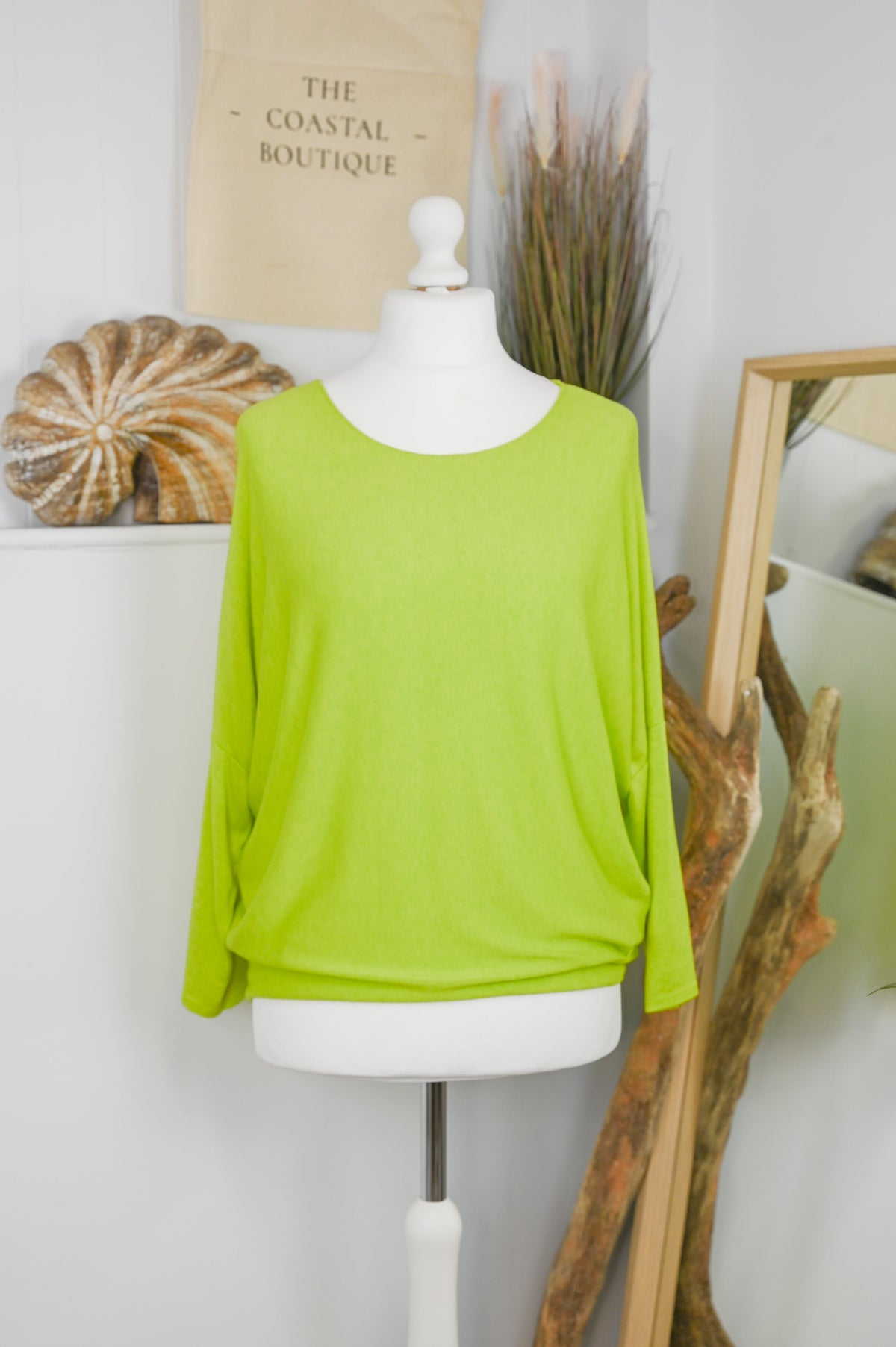 Women's long-sleeved round neck knitted jumper on a mannequin