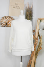 Women's long-sleeved round neck knitted jumper on a mannequin