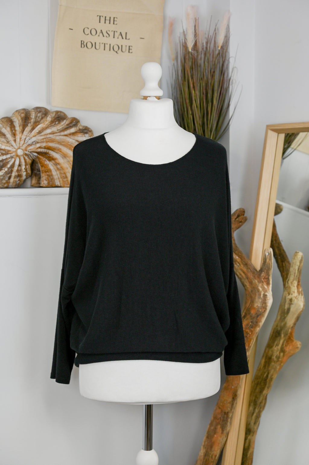 Women's long-sleeved round neck knitted jumper on a mannequin