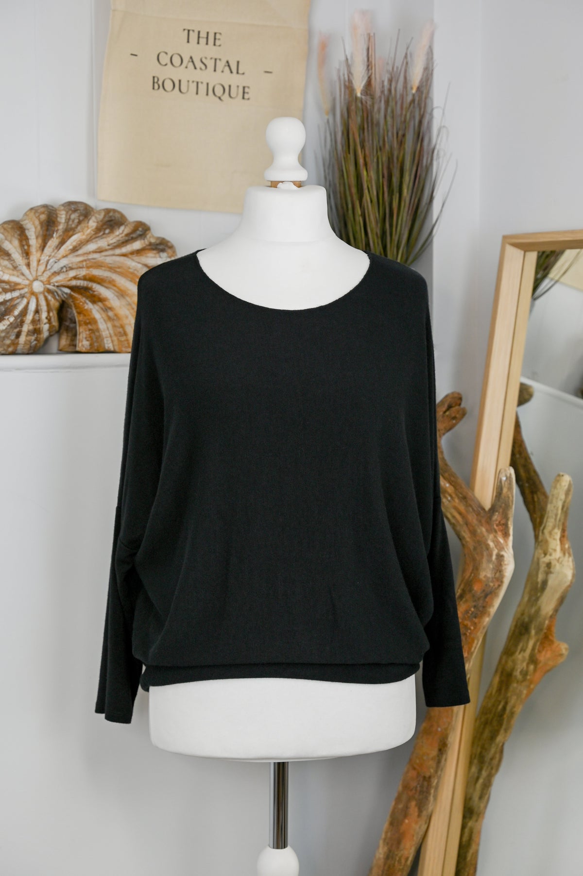 Women's long-sleeved round neck knitted jumper on a mannequin