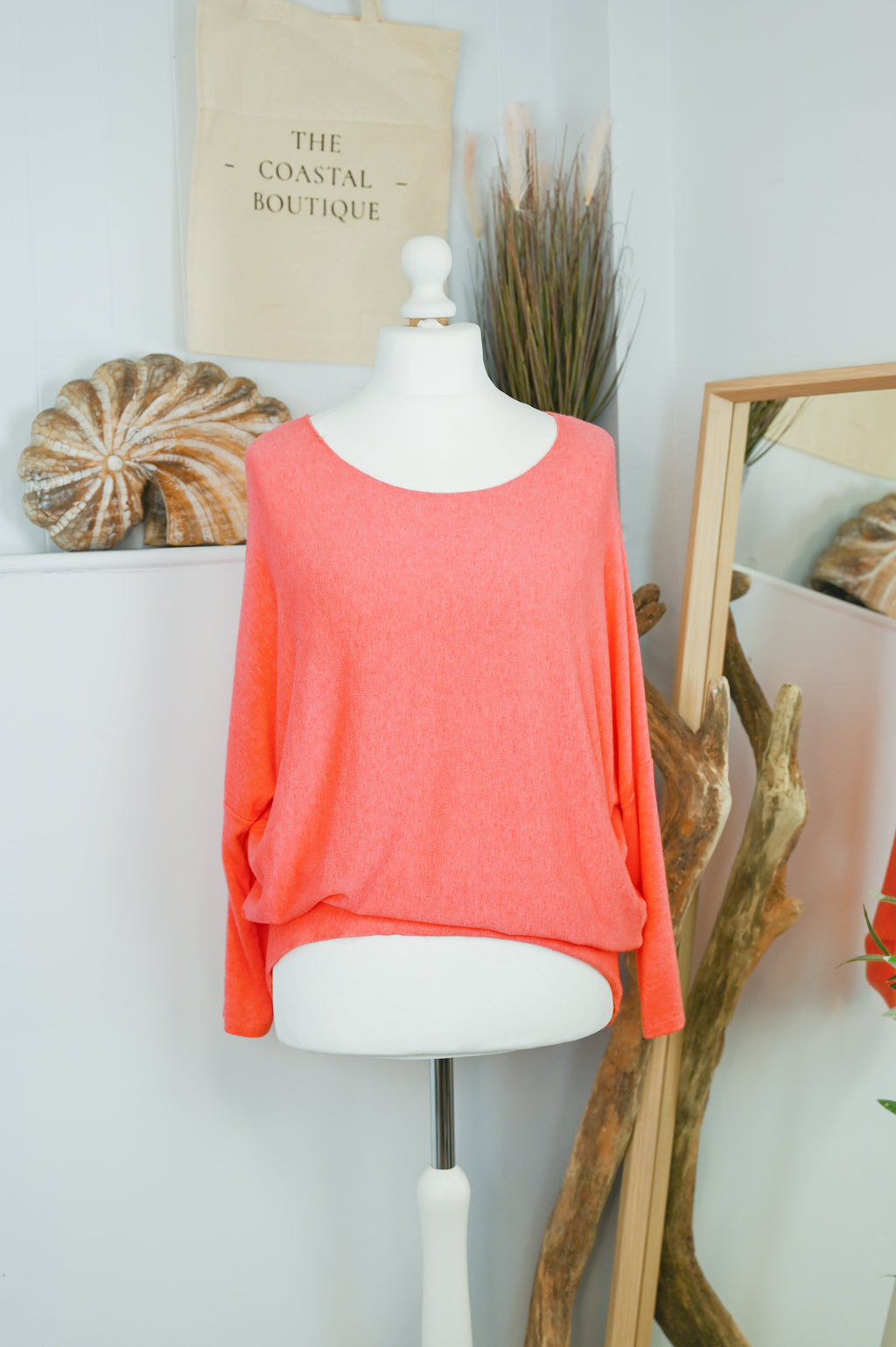 Women's long-sleeved round neck knitted jumper on a mannequin