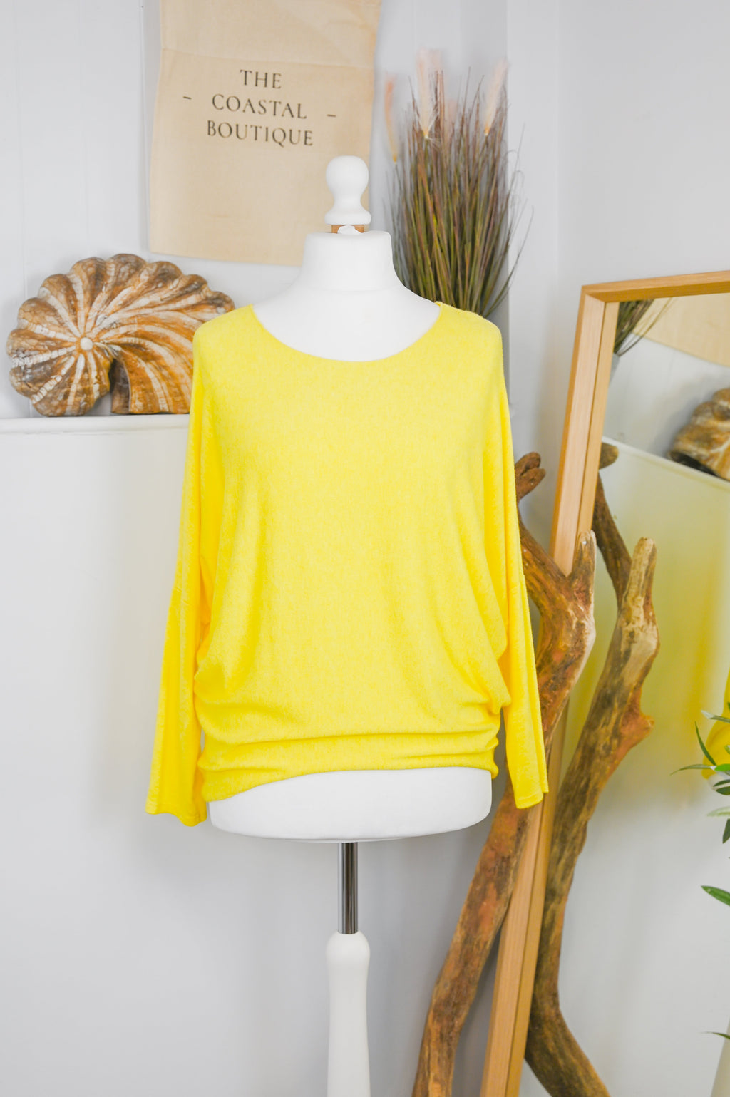 Women's long-sleeved round neck knitted jumper on a mannequin