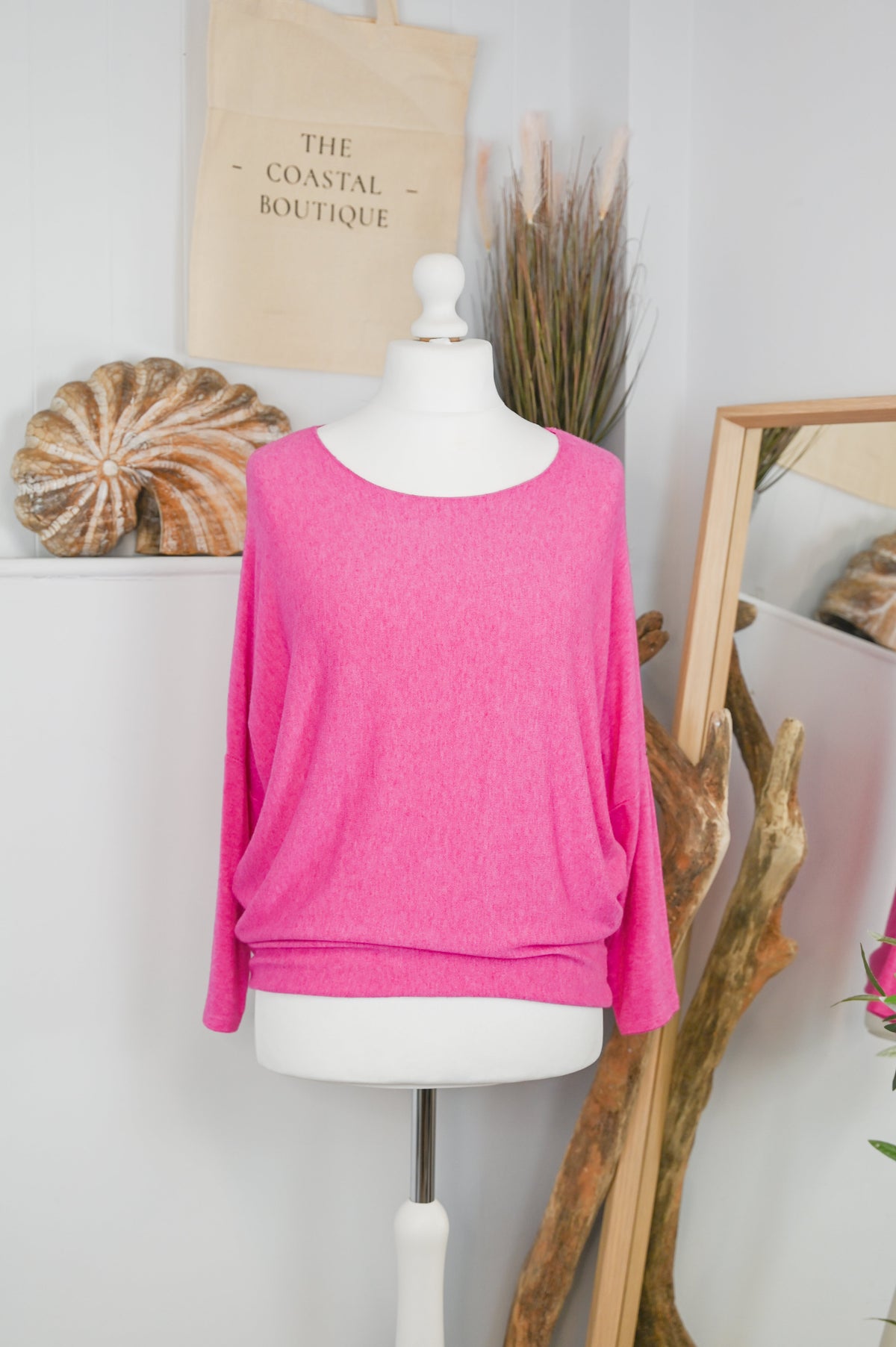 Women's long-sleeved round neck knitted jumper on a mannequin