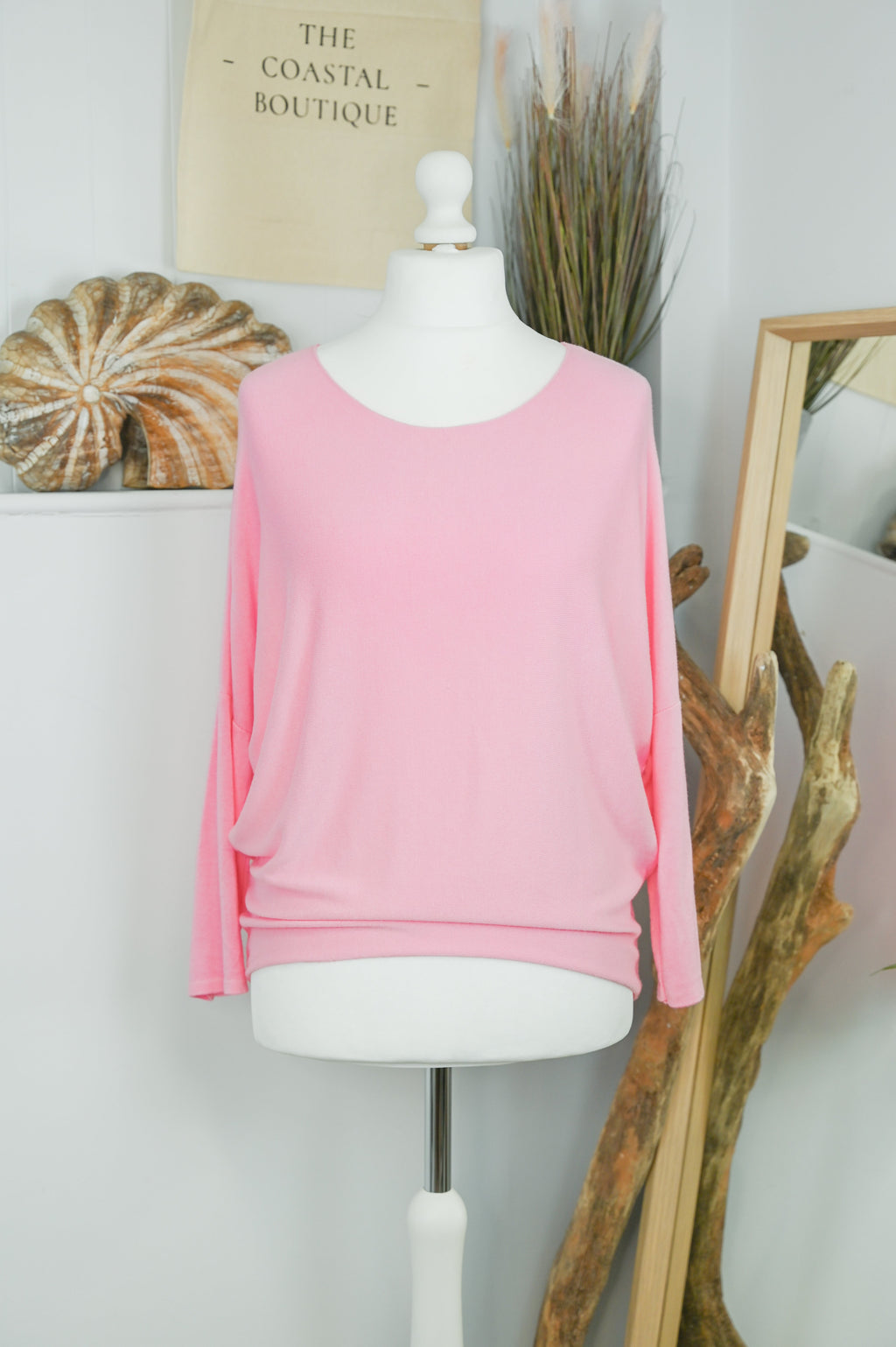 Women's long-sleeved round neck knitted jumper on a mannequin