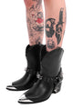 Women's black cowboy boots with silver toe caps and spiked straps