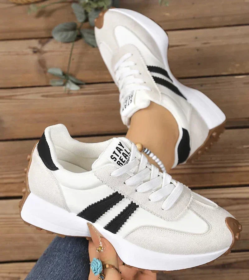 Women's low-top platform sneakers with lace-up front and contrast panel details