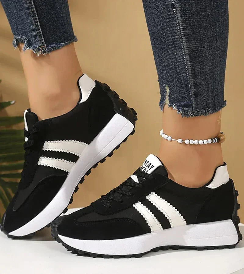 Women's low-top platform sneakers with lace-up front and contrast panel details