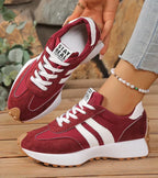 Women's low-top platform sneakers with lace-up front and contrast panel details