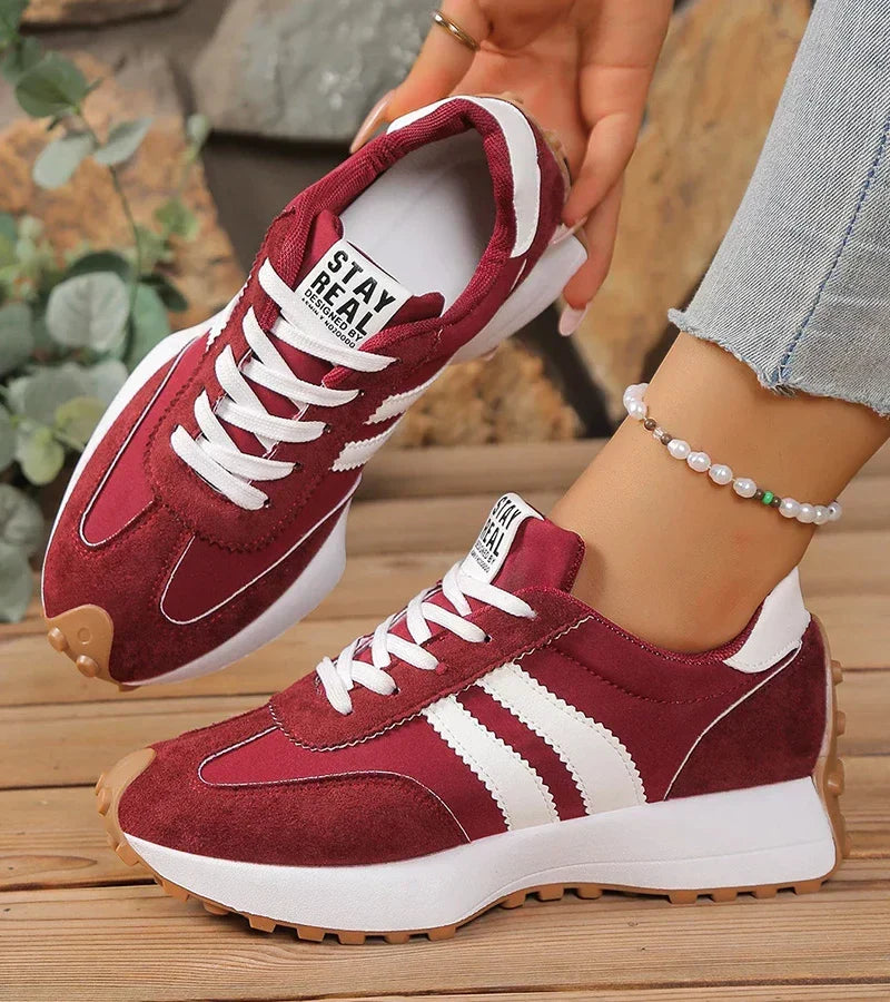 Women's low-top platform sneakers with lace-up front and contrast panel details