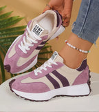 Women's low-top platform sneakers with lace-up front and contrast panel details