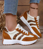 Women's low-top platform sneakers with lace-up front and contrast panel details