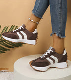 Women's low-top platform sneakers with lace-up front and contrast panel details