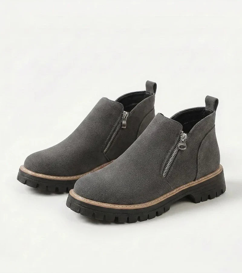 Women's ankle boots with side zips, rounded toes and chunky lug soles