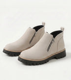 Women's ankle boots with side zips, rounded toes and chunky lug soles
