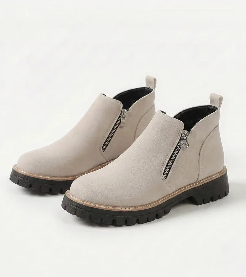 Women's ankle boots with side zips, rounded toes and chunky lug soles
