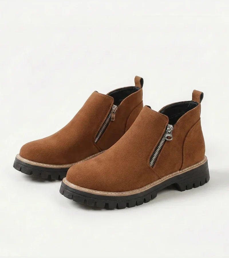 Women's ankle boots with side zips, rounded toes and chunky lug soles