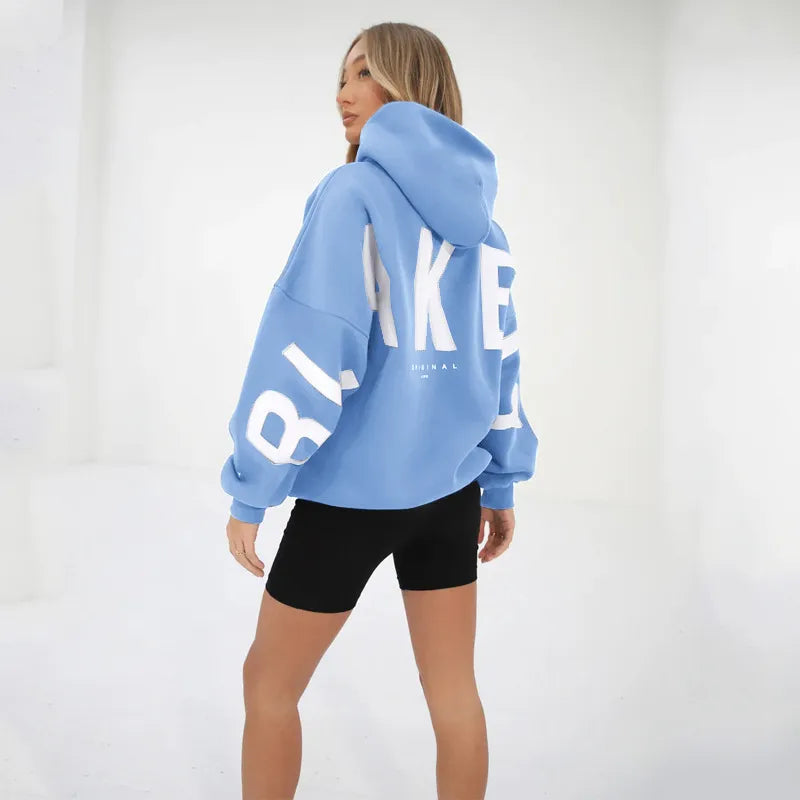 Women's graphic print hoodie with hood and bold back lettering