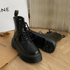 Black women's lace-up combat boots with chunky platform soles