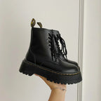Black women's lace-up combat boots with chunky platform soles