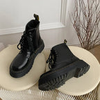 Black women's lace-up combat boots with chunky platform soles