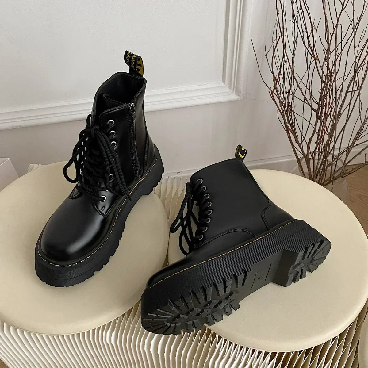 Black women's lace-up combat boots with chunky platform soles