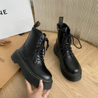Black women's lace-up combat boots with chunky platform soles