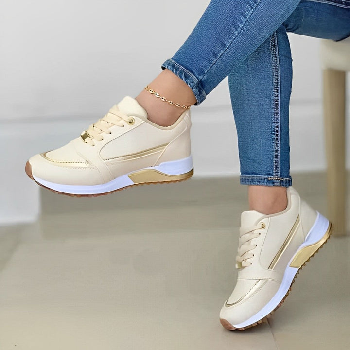 Women's lace-up running sneakers with layered panels and textured sole