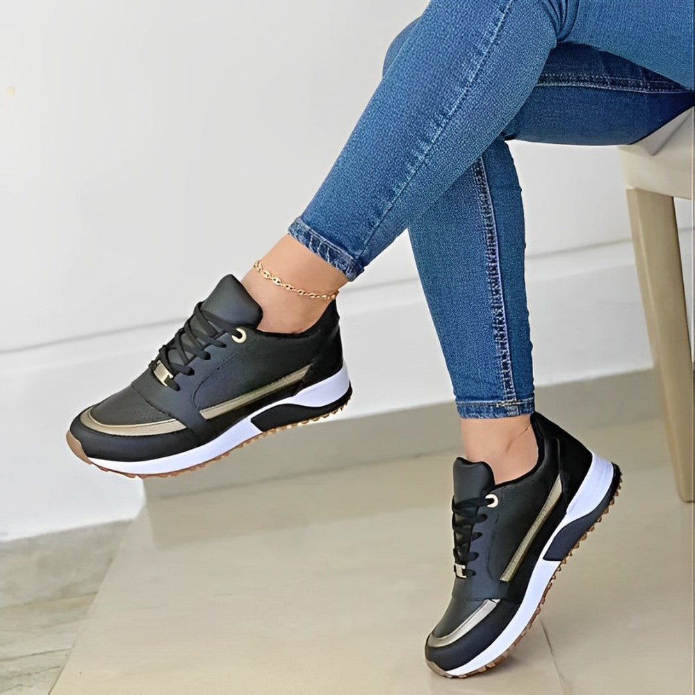 Women's lace-up running sneakers with layered panels and textured sole