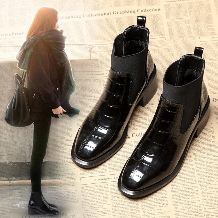 Women's black Chelsea ankle boots with glossy crocodile-effect panels and block heels