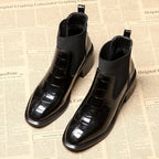 Women's black Chelsea ankle boots with glossy crocodile-effect panels and block heels