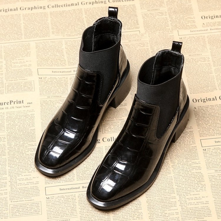 Women's black Chelsea ankle boots with glossy crocodile-effect panels and block heels