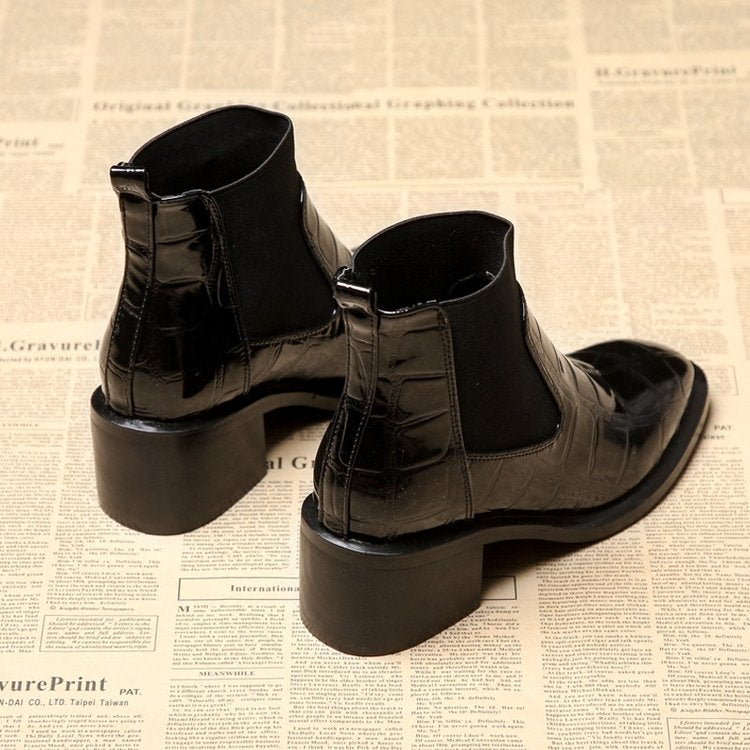 Women's black Chelsea ankle boots with glossy crocodile-effect panels and block heels
