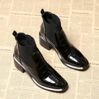 Women's black Chelsea ankle boots with glossy crocodile-effect panels and block heels
