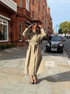 Women's beige belted trench coat with cape overlay and long sleeves