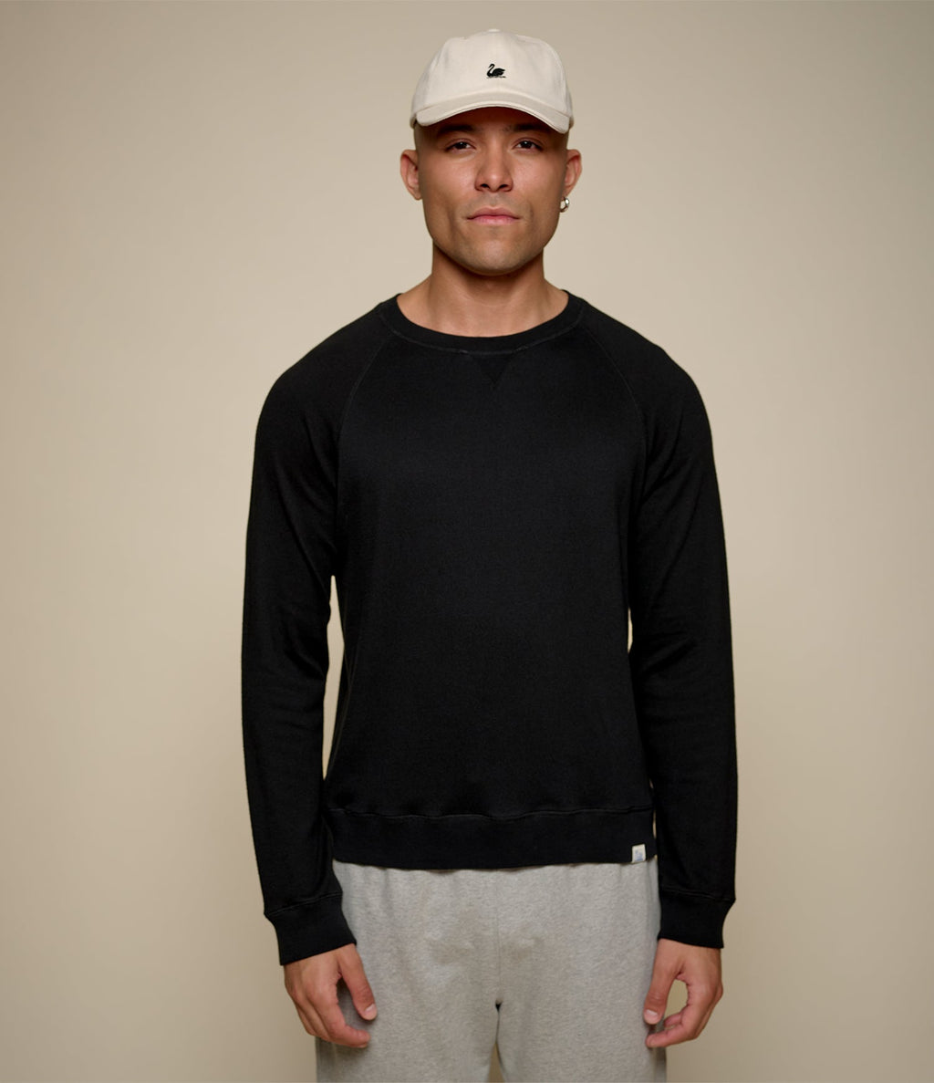 Men's black raglan crew neck sweatshirt with ribbed hem