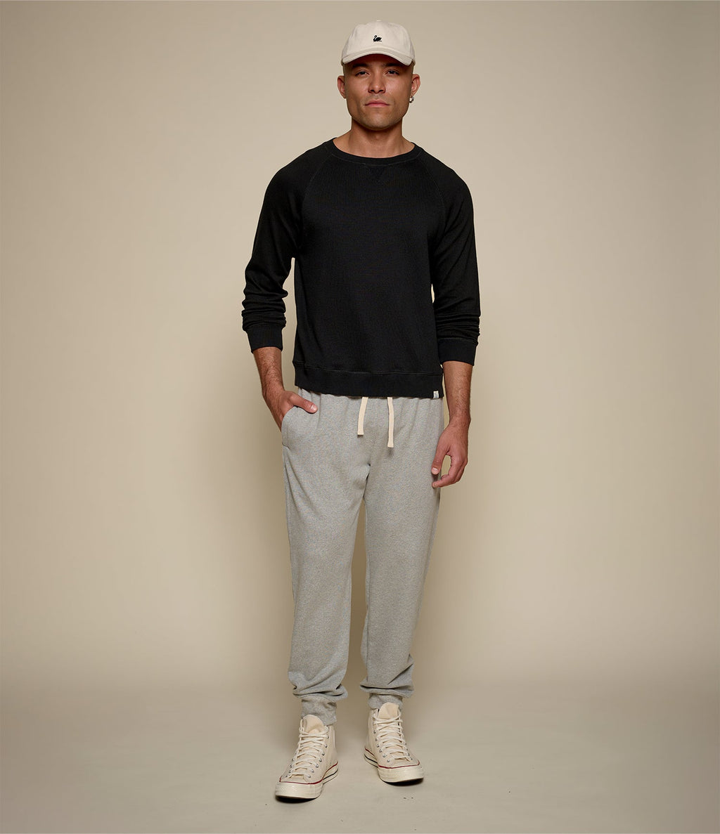 Men's black raglan crew neck sweatshirt with ribbed hem