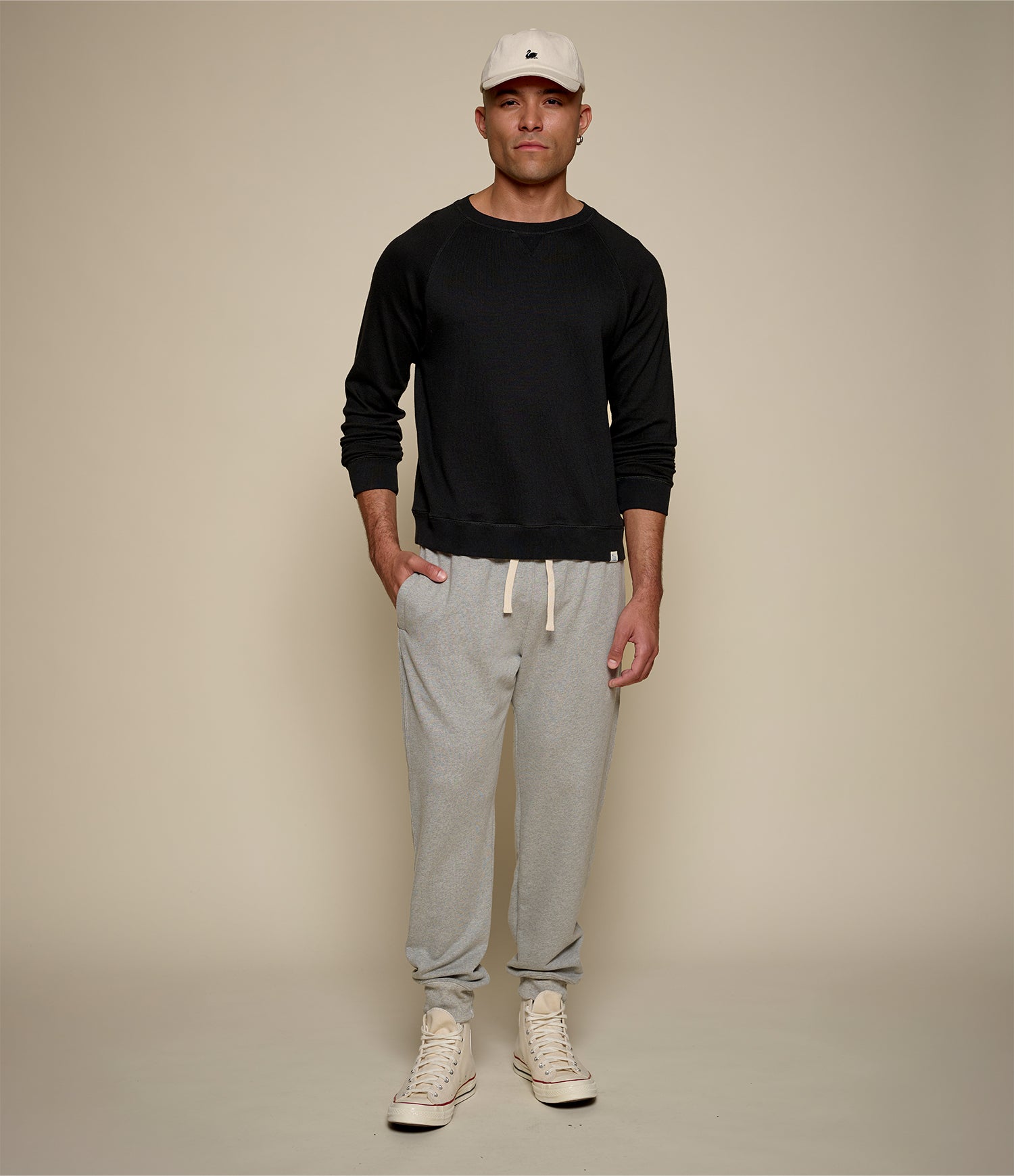 Men's black raglan crew neck sweatshirt with ribbed hem