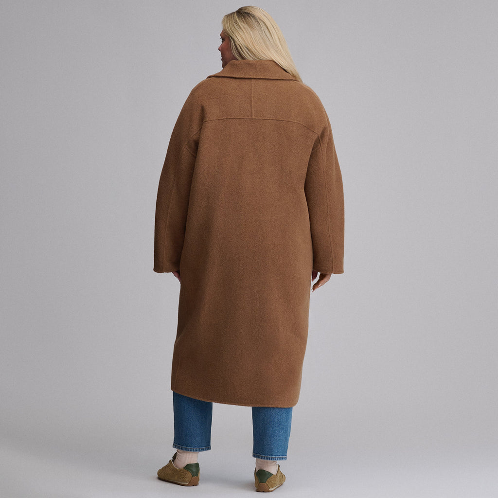 Women's camel long coat with notched lapels, front buttons and patch pockets