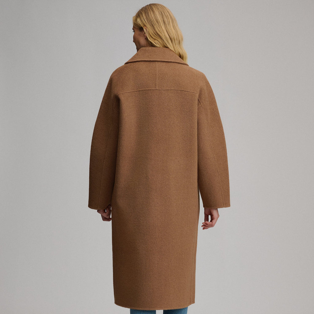 Women's camel long coat with notched lapels, front buttons and patch pockets