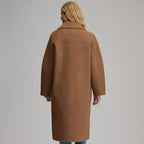 Women's camel long coat with notched lapels, front buttons and patch pockets