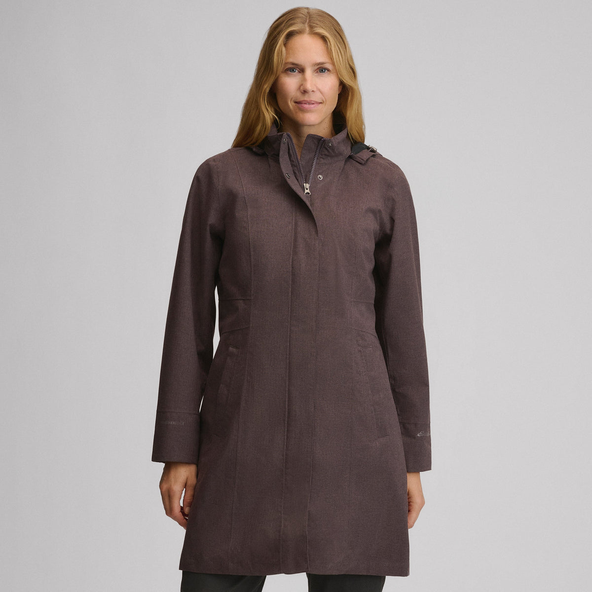 Women's hooded waterproof trench coat with long sleeves and front pockets