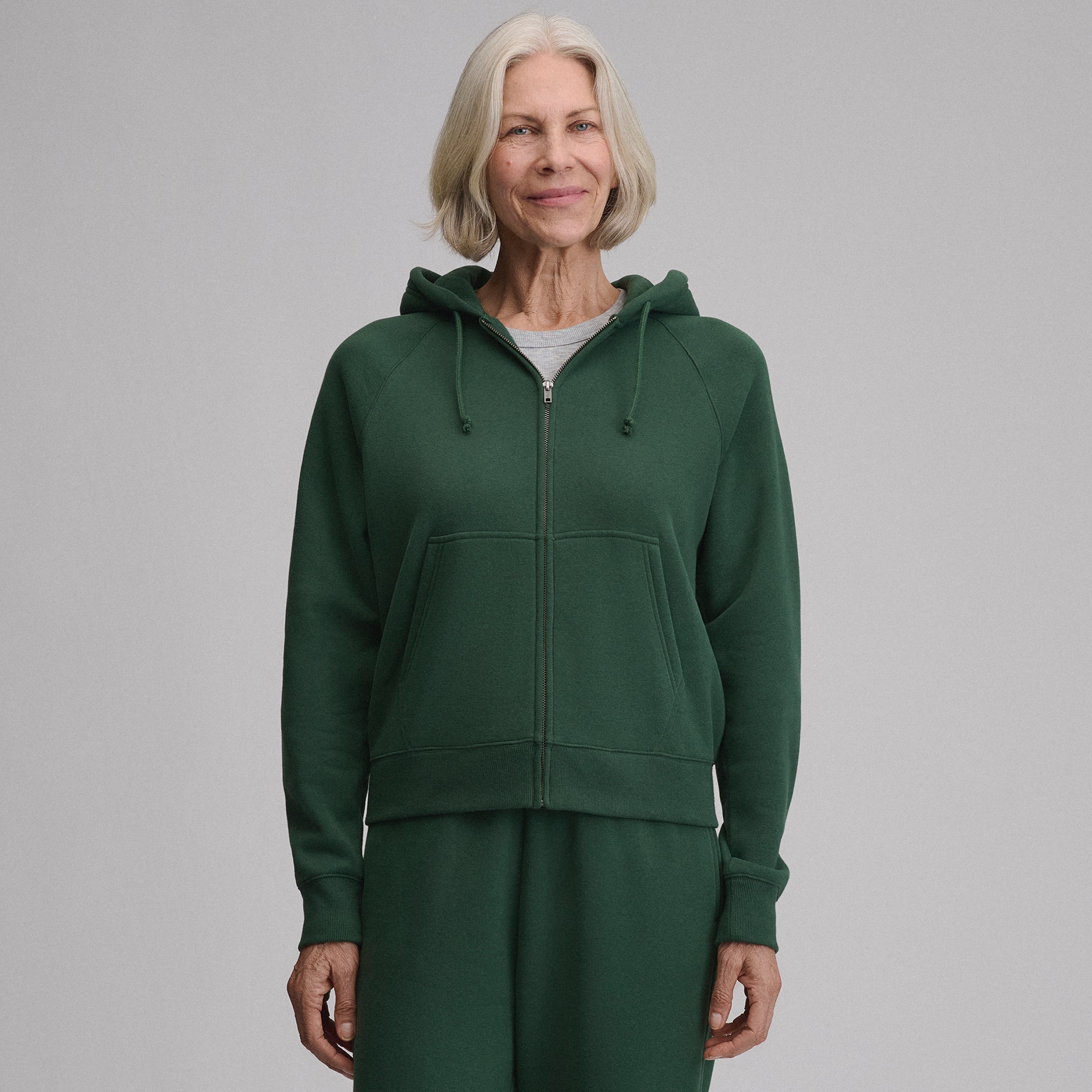 Women's full-zip hoodie with drawstring hood and front pouch pockets