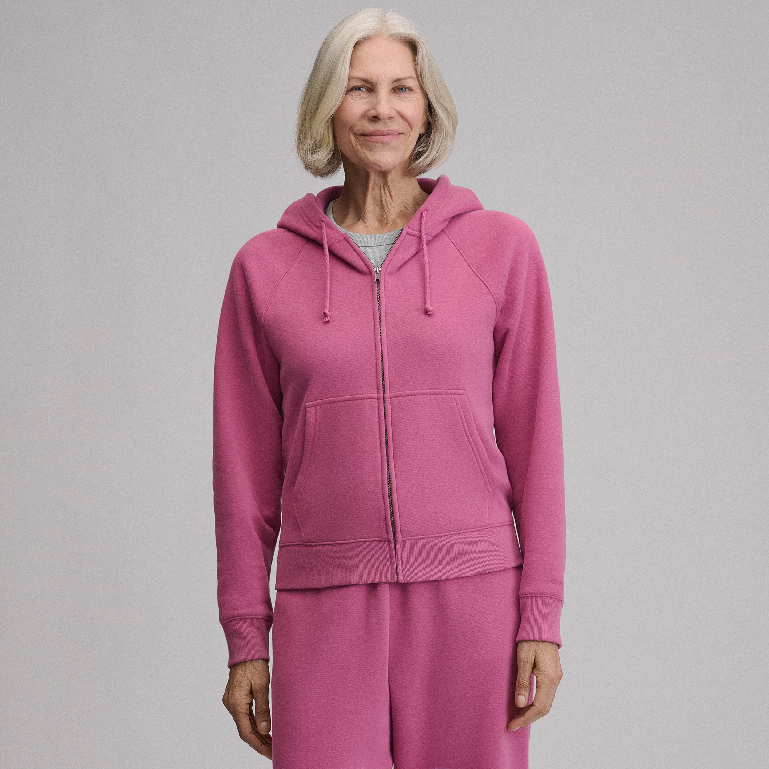 Women's full-zip hoodie with drawstring hood and front pouch pockets