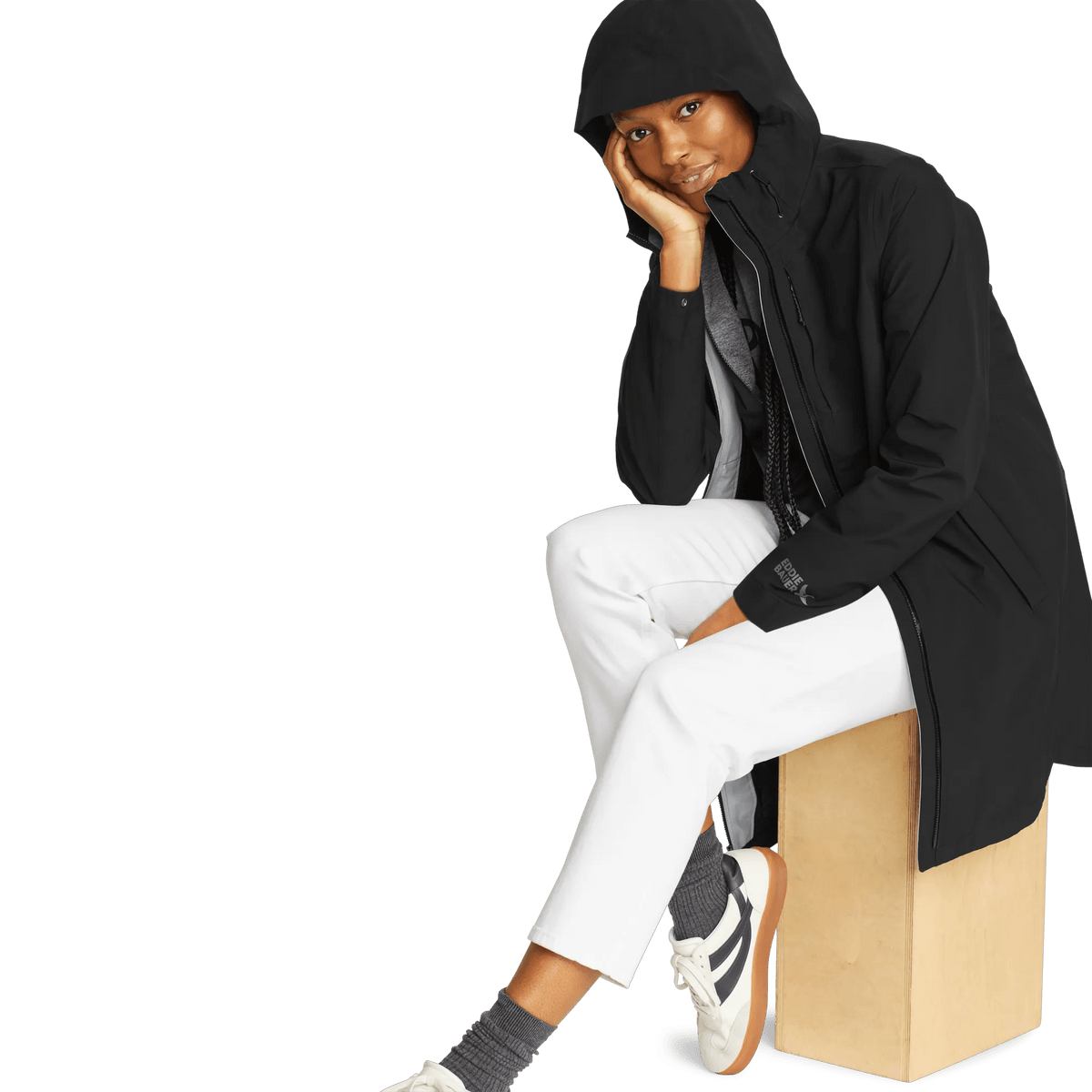 Women's black hooded waterproof trench coat with long sleeves and front zip